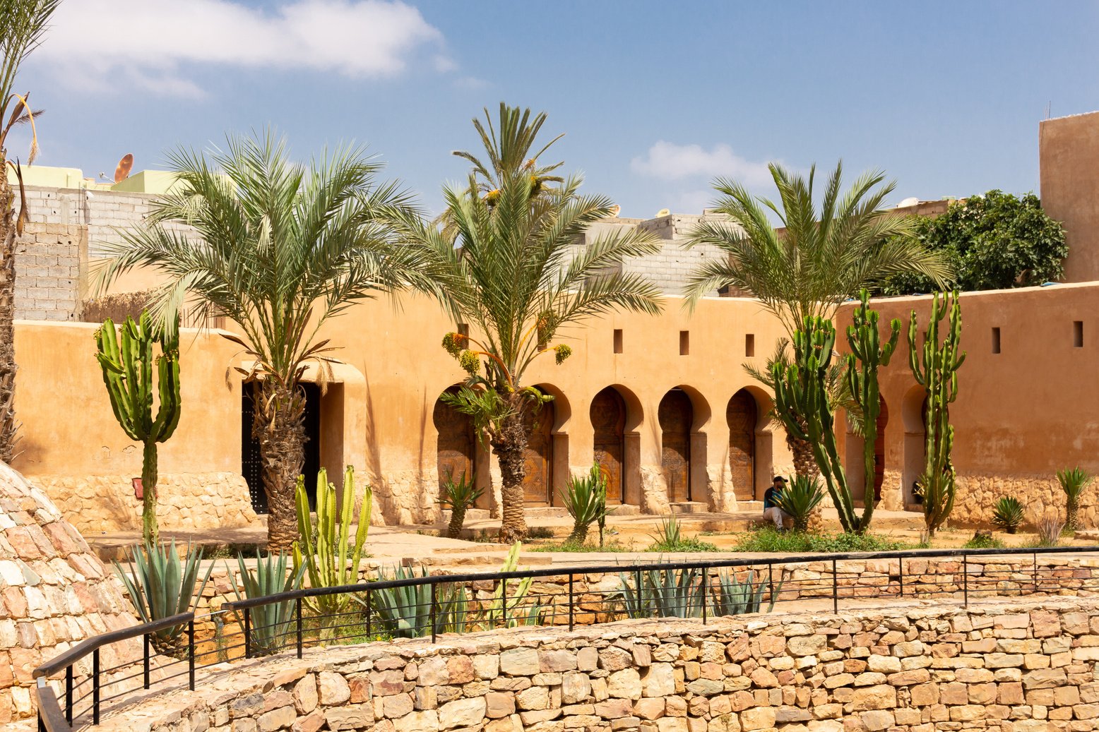 Historic building  with palm trees in Tiznit, Morocco